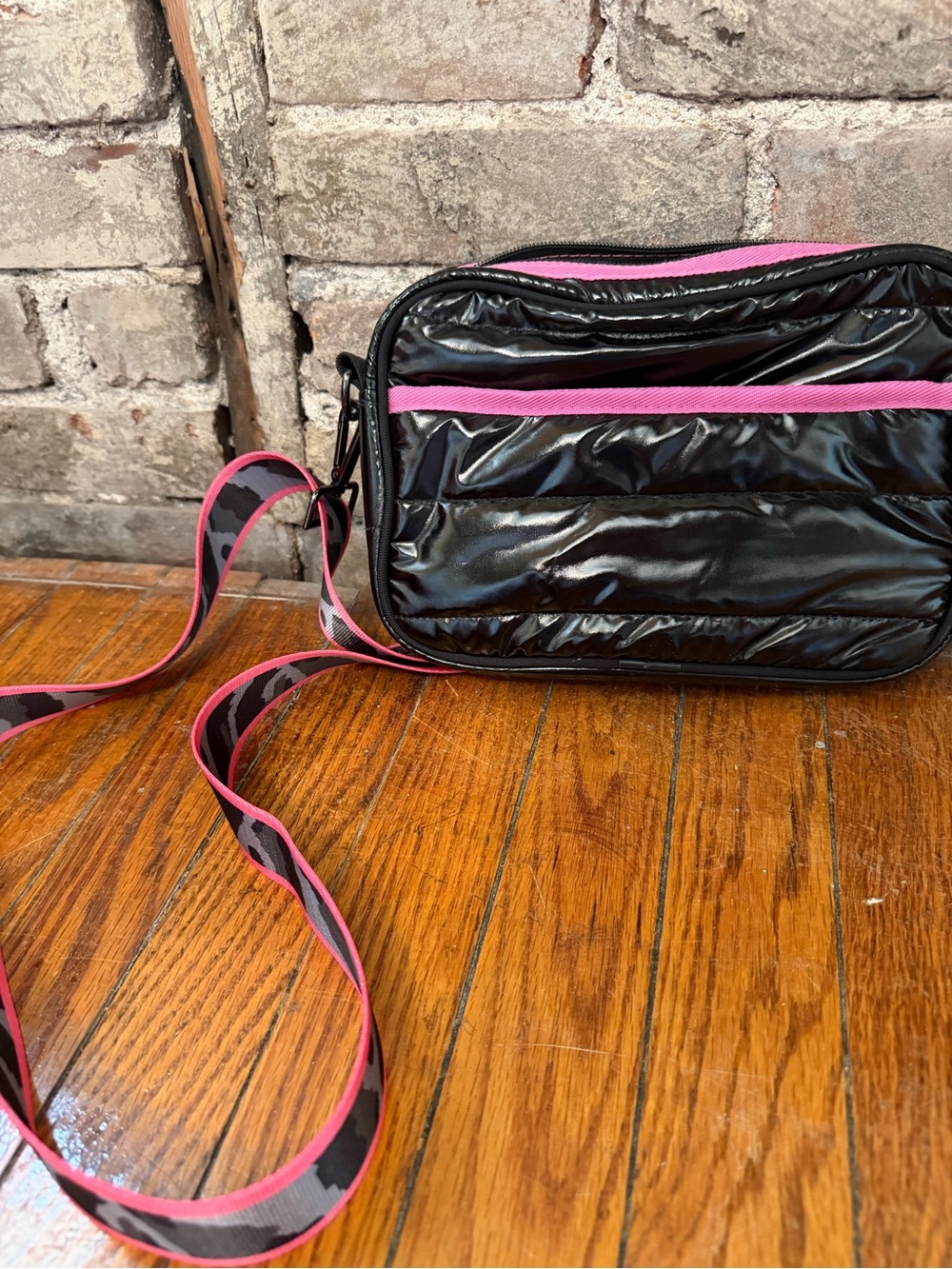 HAUTE SHORE Black Quilted Crossbody with Pink Trim and Patterned Strap